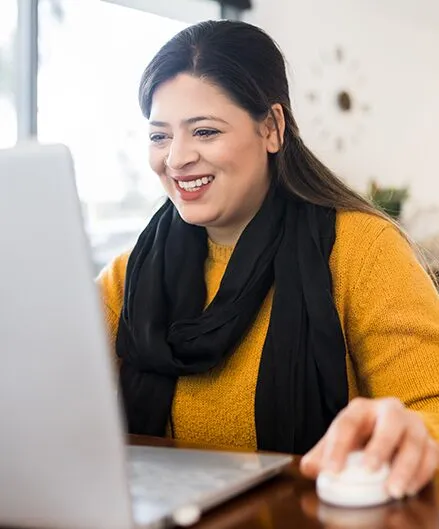 teacher at laptop taking pd