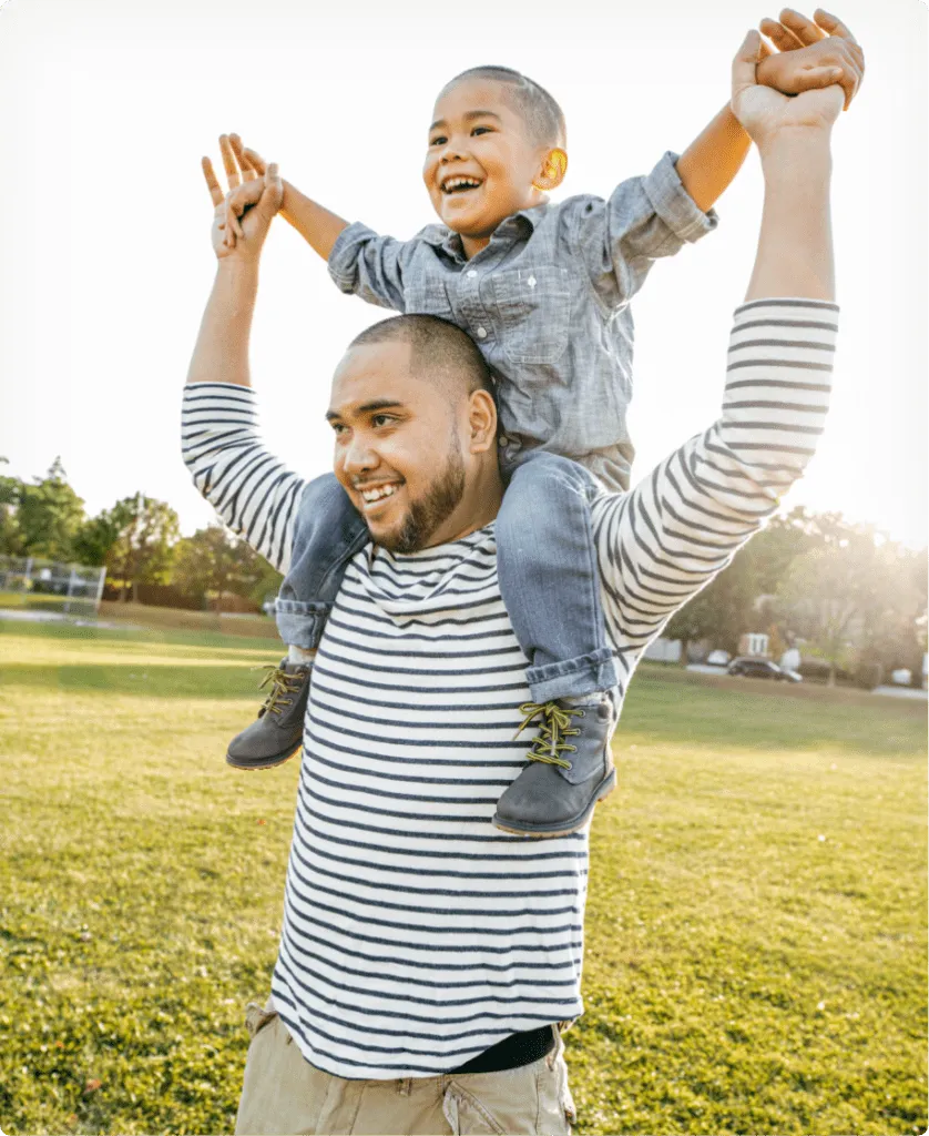 father and son outdoors enjoying themselves