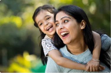 happy mother and daughter outdoors