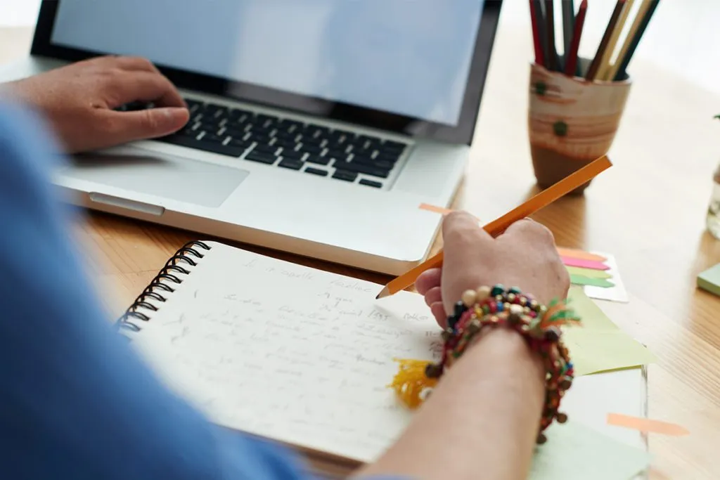 over the shoulder image of a teacher planning her day